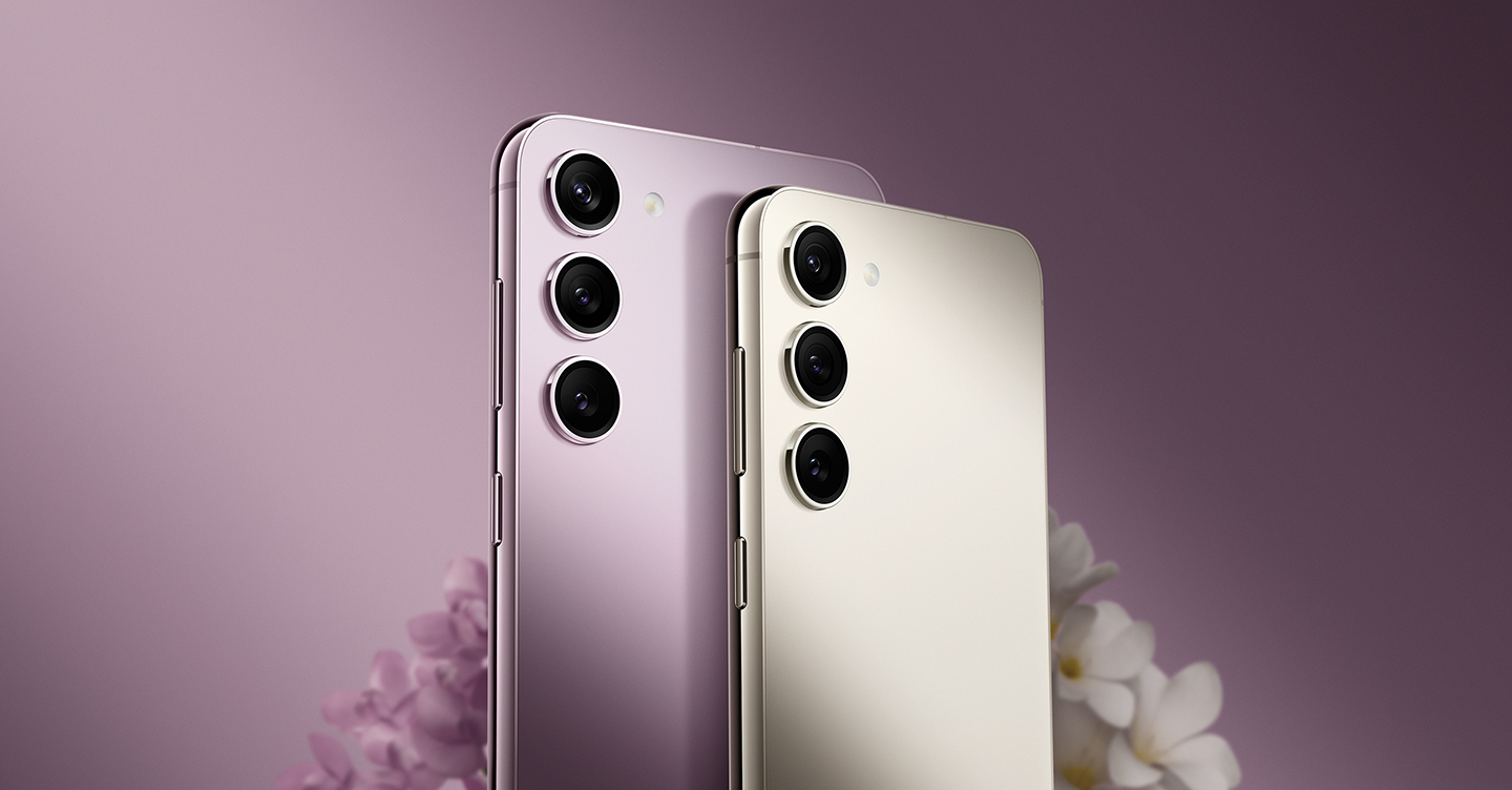 Galaxy S23 in Cream and S23 plus in Lavender are side by side and seen from the rear at a slight angle that shows the metal frame on the side.